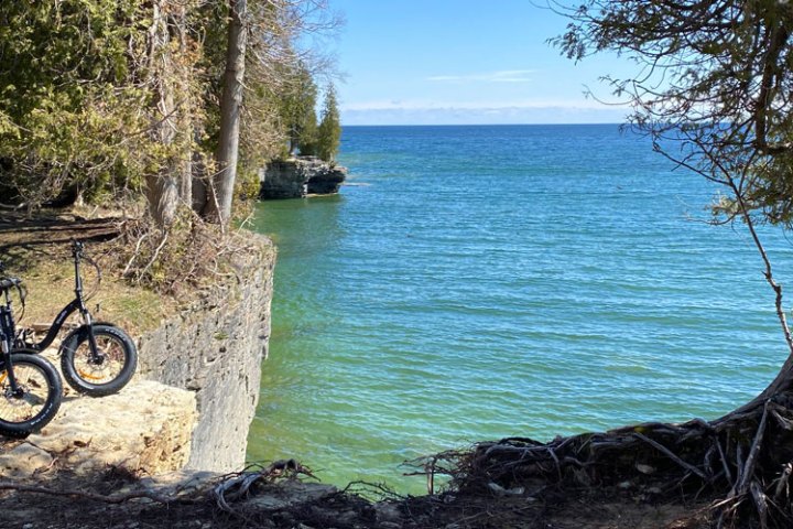 a bicycle is parked next to a body of water